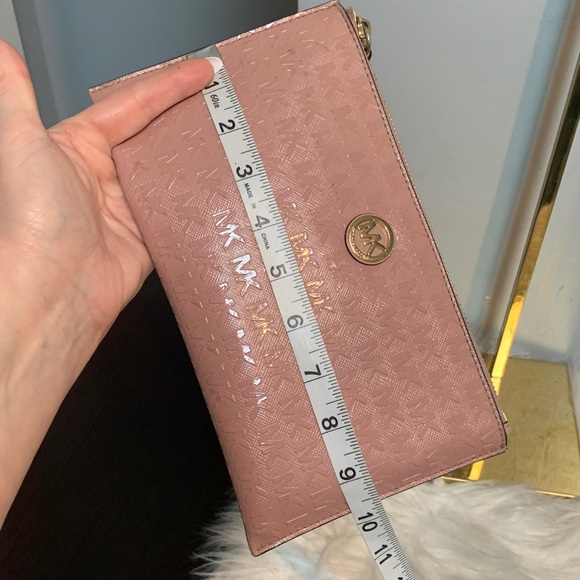 Authentic soft pink patent leather large wristlet clutch by Michael Kors
